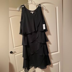 Beautiful brand new with tags, Dress Barn black dress. Size 14. Costs $52.